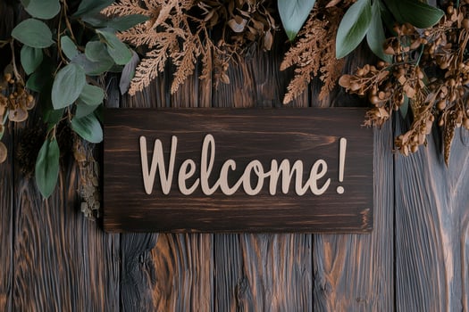 Welcome sign with autumn leaves and greenery photo