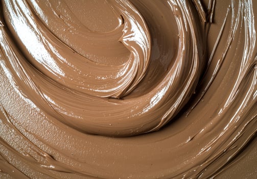 Close up of creamy chocolate swirl texture photo