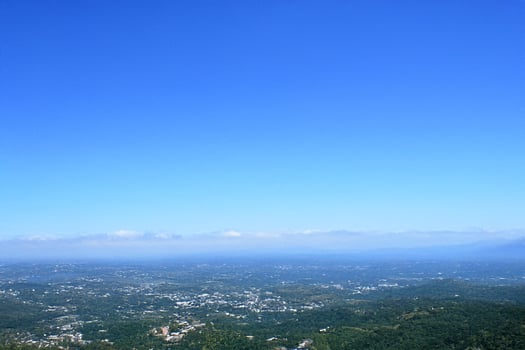 Mountaintop vista city, hazy hills, clear sky photo