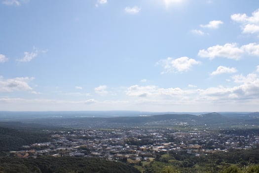 Hilltop view Sunny town, valley landscape, summer photo