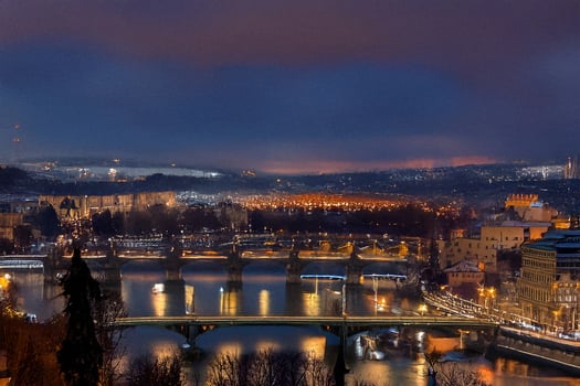 Night city panorama, river bridges, hazy skyline, tourism photo