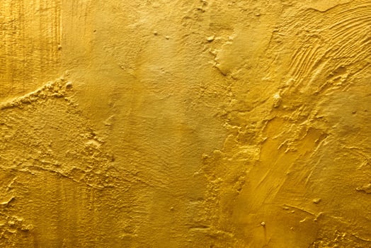 Gold Paint on Concrete Wall Texture Background photo