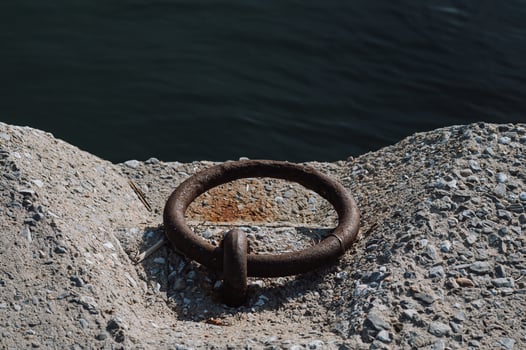 The fishing harbor shows its age with corroded fittings and wooden piers photo