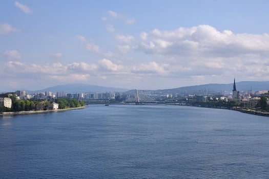 River panorama, city skyline, bridge, sunny day, travel photo