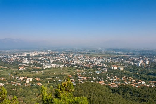 Hilltop city panorama sprawling suburbs, clear sky photo