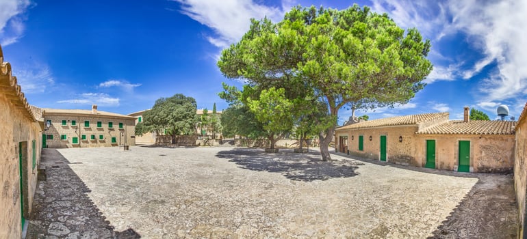 Courtyard of a famous Mallorcan monastery with green shutters1 photo