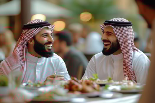 Friends sharing a joyful meal in a lively Middle Eastern restaurant during evening hours photo