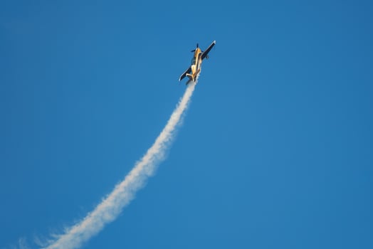 Stunt aerobatic plane performing stunts in air photo