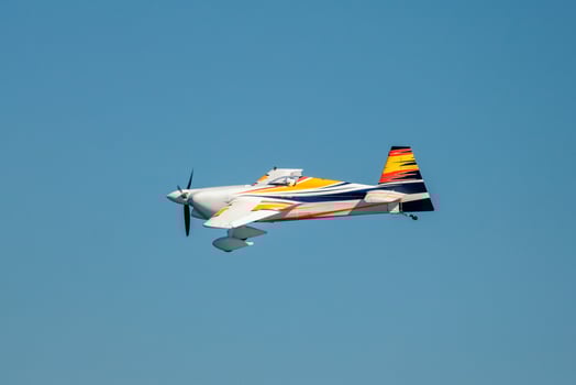 Stunt aerobatic plane performing stunts in air photo
