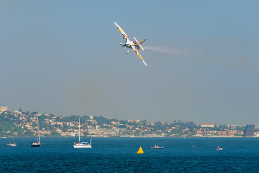 Stunt aerobatic plane performing stunts in air photo