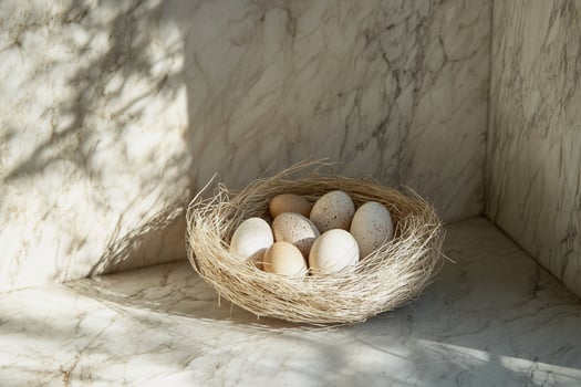 Warm light filters through onto a nest of speckled eggs, highlighting their intricate details. A stunning Easter-inspired composition that evokes peace, tradition, and timeless beauty. photo
