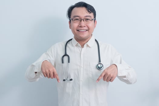 Asian man doctor, nurse pointing pose isolated white background. photo