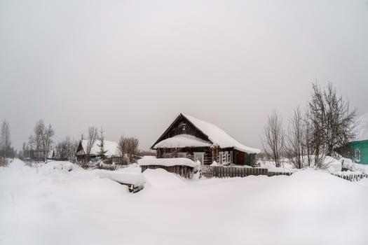 The village is covered with snow. photo