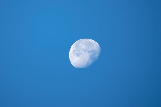 Close up white moon in the evening blue sky. photo