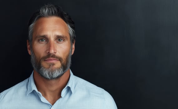 Portrait of a handsome mature man with gray hair and beard. photo