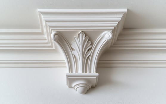 White ornate ceiling detail with acanthus leaf design photo