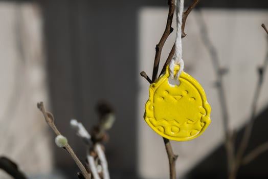 Do it yourself air dry clay crafts for Easter holiday. Decoration sustainable eco-friendly gift idea Handmade children craft. Step by step instruction of painting, pressing figures on wooden twig photo