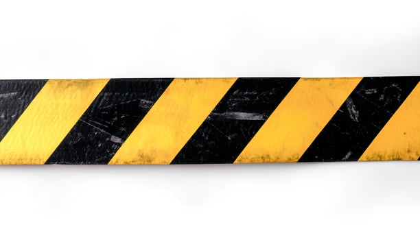 detailed horizontal strip of black and yellow warning tape displayed on a white background with shadow perfect for construction purposes industrial safety or restricted area designs photo