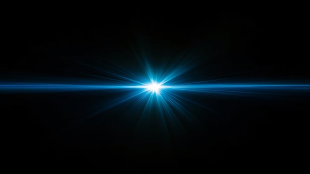 Bright burst of blue light expanding in the dark photo