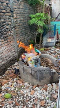 a fire is burning in a cement bowl photo