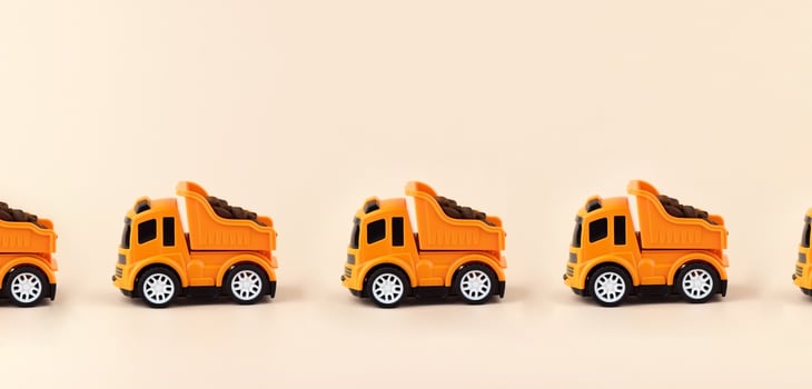 the toy truck with coffee on a light background. photo