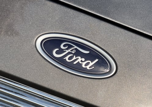 Lodz, Poland January 16 2025 Ford logo emblem closeup, oval-shaped with navy blue background photo