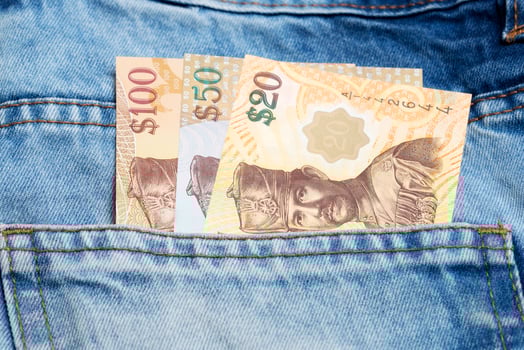 Brunei dollar in the pocket of blue jeans photo