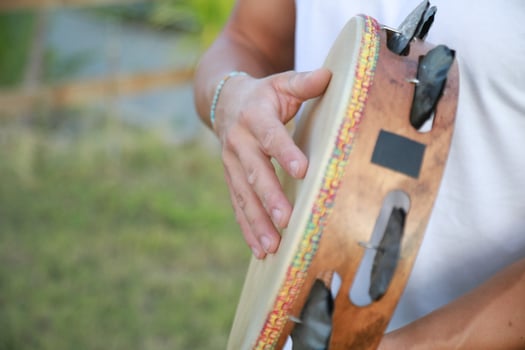 Joyful Tambourine Beats in Rolling Countryside photo