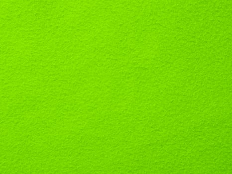 A green background with a green fabric photo