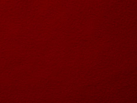 A close up of a red fabric with a rough texture photo