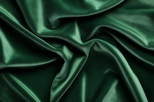Luxurious Green Satin Fabric with Elegant Folds and Silky Texture photo