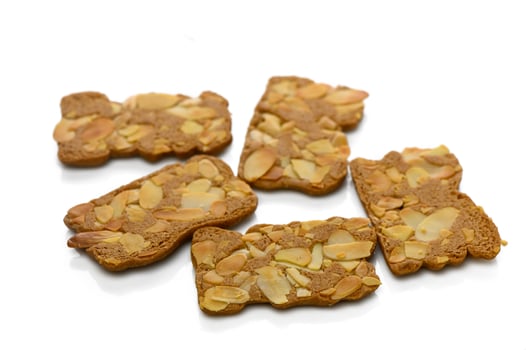 Deliciously crunchy gingerbread cookies topped with sliced almonds for a sweet treat photo