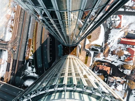 Aerial View of Modern Skyscrapers Framing Snow Covered Urban Streets photo