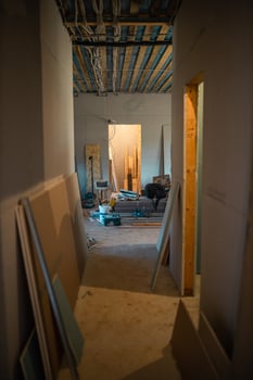 Indoor Construction Site with Exposed Beams and Tools photo