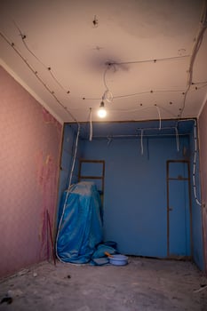 Interior Room Under Renovation with Exposed Wiring and Materials photo
