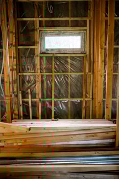 Interior of Building Under Construction with Exposed Framing and Materials photo