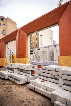 Urban Construction Site with Structural Frames and Crane Visible photo