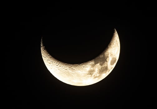 crescent moon glowing above clouds 5 photo