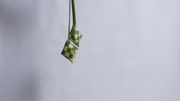 Ketupat Packaging for Cooking Rice During Ramadan and Eid Mubarak photo