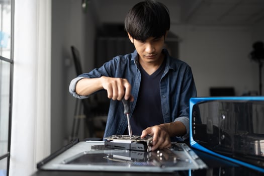 IT Engineer man is working on a computer photo