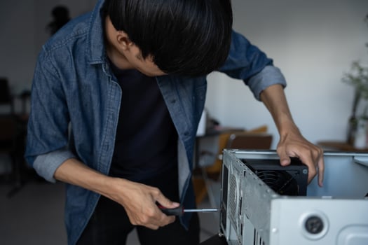 IT Engineer man is fixing a computer case photo