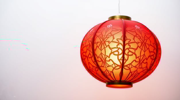 Traditional Red Lantern with Modern Gold Geometric Design photo