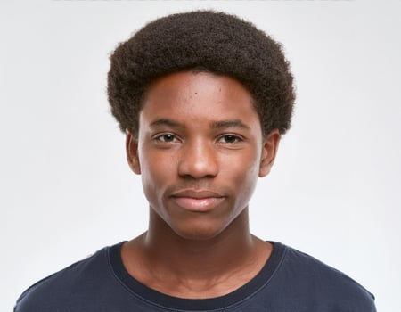 Portrait of African Teenager with Hairstyle and Expression on White Background photo