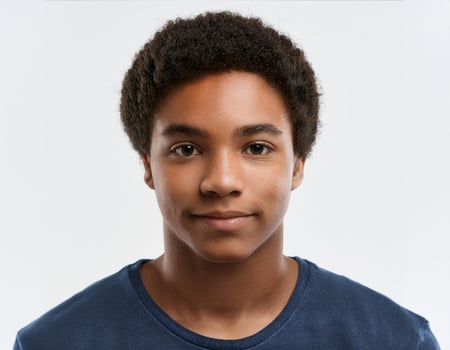 Studio Portrait of African Teenager with Short Cut Hairstyle on White Background photo