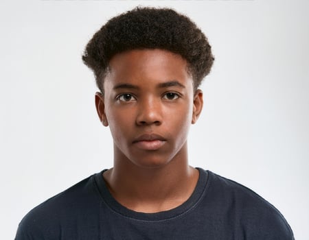 Close Up Portrait of African Teenager with Relaxed Hairstyle on White Background photo