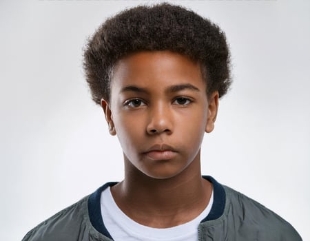 Portrait of African Teenager with Natural Textured Curls on White Background photo