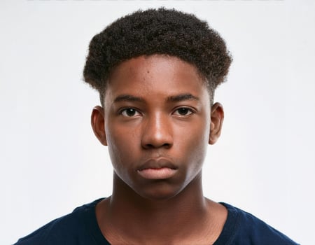 Studio Portrait of African Teenager with Defined Wavy Hairstyle on White Background photo