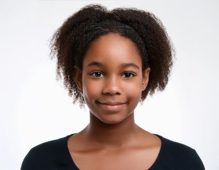 Studio Portrait of African Teenager with Defined Short Natural Curls on White Background photo