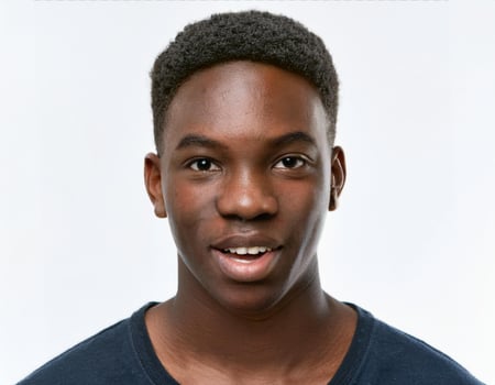 Close Up Portrait of African Teenager with Defined Defined Loose Curls on White Background photo