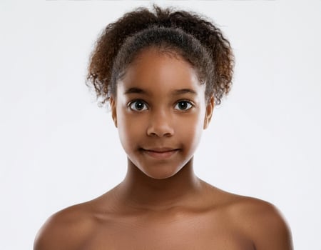 Portrait of African Teenager with Defined Defined High Curls and Expression on White Background photo